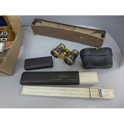 687 - A box of assorted items including micrometer, A.W. Faber slide rule, opera glasses, pen, razors, etc... 