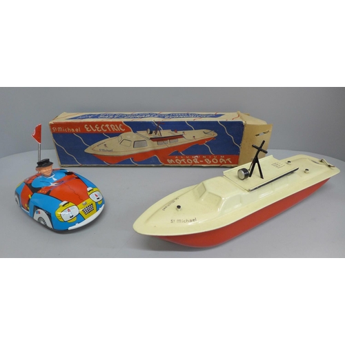 701 - A St. Michael Electric aluminium motor boat, boxed, and a tin plate dodgem, marked GDR, boxed, (2)