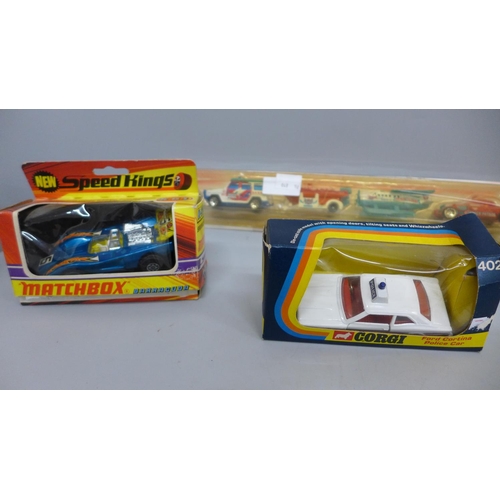 703 - A Matchbox Speedkings 'Barracuda' model car, a Roadsterz Street Machine, Corgi Ford Contina police c... 