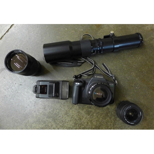 707 - A Canon EOS 600 camera, lenses and flash gun