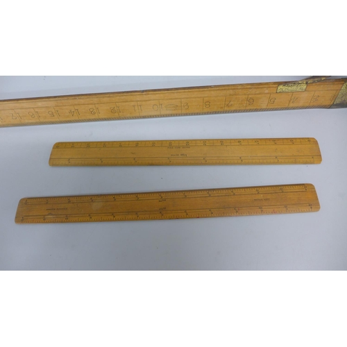 787 - A tailor's wooden square and two wooden rulers