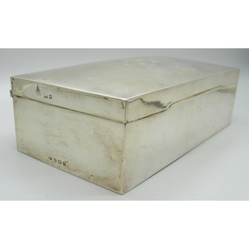 817 - A silver cigarette box with monogram to lid, Birmingham 1916, 359g