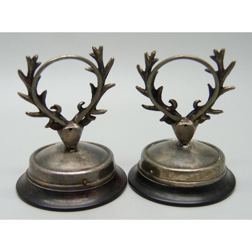 827 - A pair of silver stag menu holders, Birmingham 1907, possibly Sydney & Co.