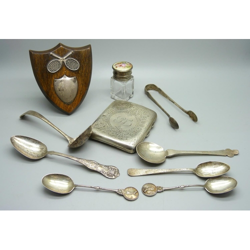 829 - A silver cigarette case, six silver spoons, a pair of silver sugar bows, a silver topped bottle and ... 