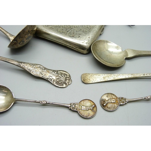 829 - A silver cigarette case, six silver spoons, a pair of silver sugar bows, a silver topped bottle and ... 