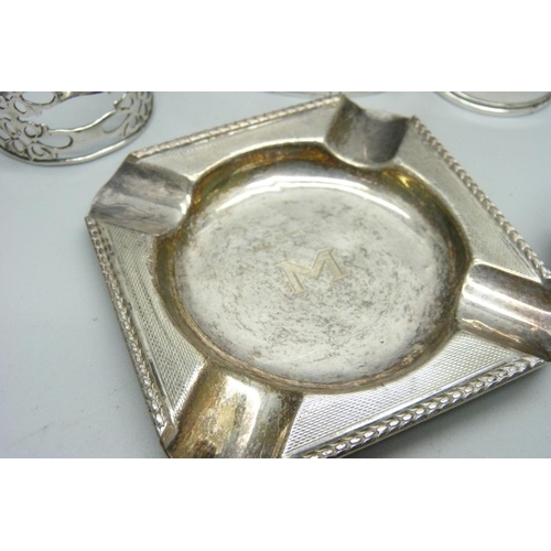 832 - A collection of silver including napkin rings, 148g