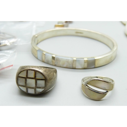 856 - A collection of silver and silver mounted mother of pearl jewellery