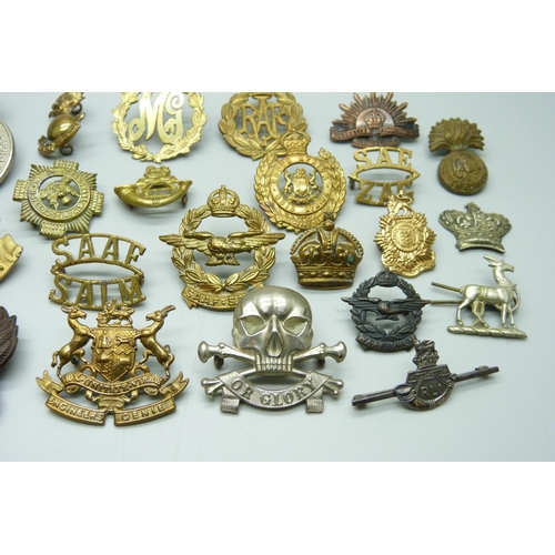 874 - Assorted cap and other badges including Death Or Glory, Boer War Natal Mounted Rifles, a silver RLI ... 