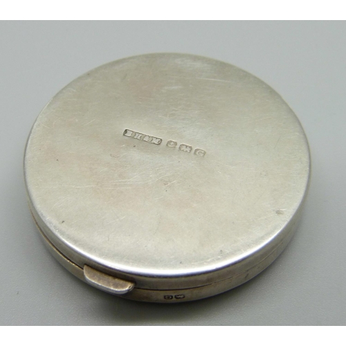 897 - A hallmarked silver compact, 43mm