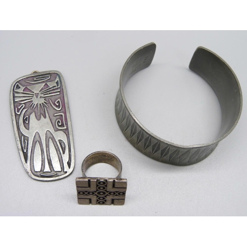 913 - A Jorgen Jensen pewter bangle and pendant and a silver ring, N