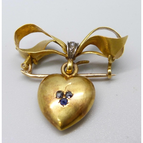 934 - An antique 15ct gold, diamond and sapphire set heart shaped brooch, 4.3g