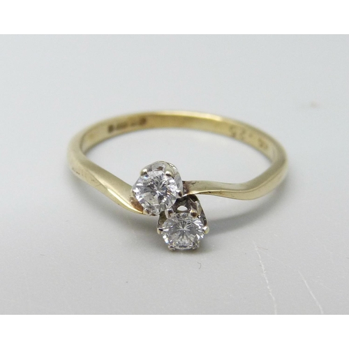 946 - A 9ct gold and two stone diamond ring, 1.5g, M