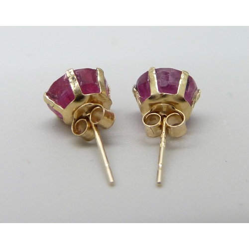 951 - A pair of 9ct gold and ruby stud earrings, approximately 2ct weight