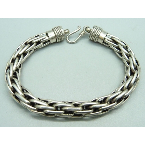 960 - A heavy silver bracelet, 58g