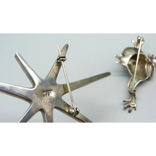 964 - A Mexican silver frog brooch and a Mexican star brooch