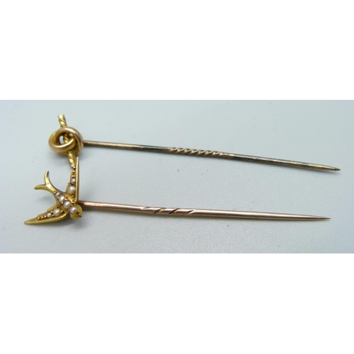 967 - A stick pin, the top marked 15ct, and a pearl set swallow stick pin