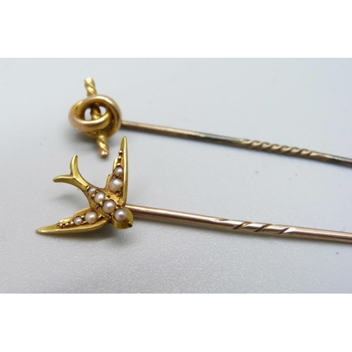 967 - A stick pin, the top marked 15ct, and a pearl set swallow stick pin