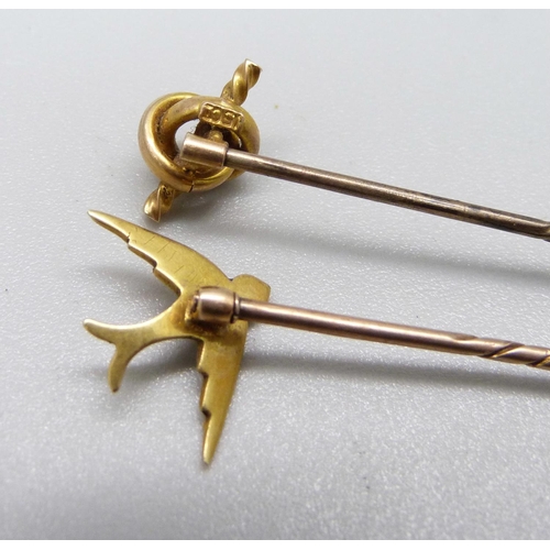 967 - A stick pin, the top marked 15ct, and a pearl set swallow stick pin