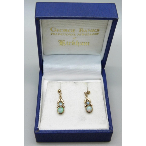 976 - A pair of 9ct gold and opal earrings