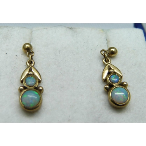 976 - A pair of 9ct gold and opal earrings