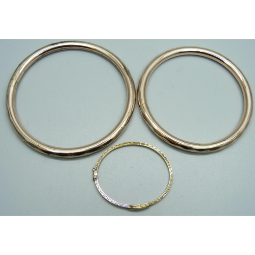 985 - Two rolled gold bangles and a baby's bangle