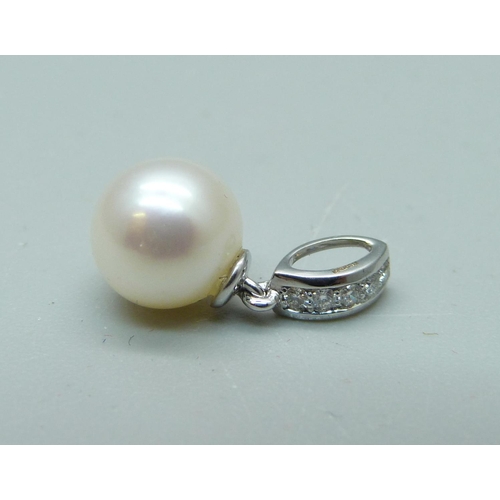 990 - An 18ct white gold, diamond and pearl pendant