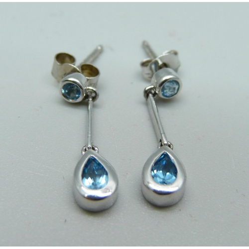 993 - A pair of 9ct white gold and teardrop aquamarine earrings