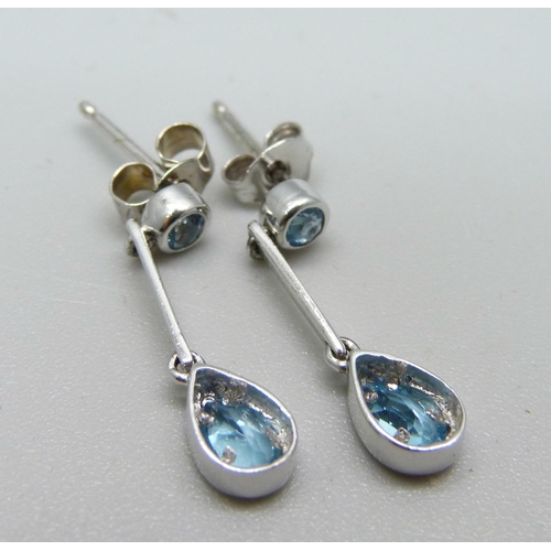 993 - A pair of 9ct white gold and teardrop aquamarine earrings