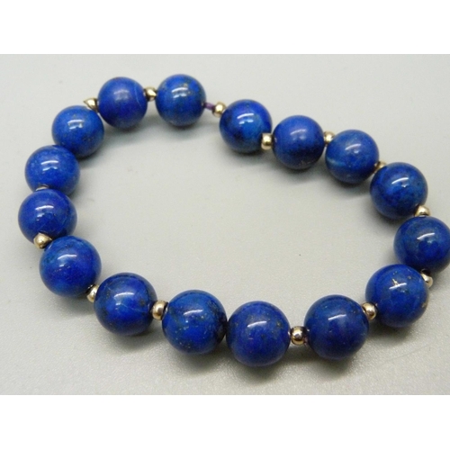 997 - A lapis lazuli bracelet with yellow metal spacers