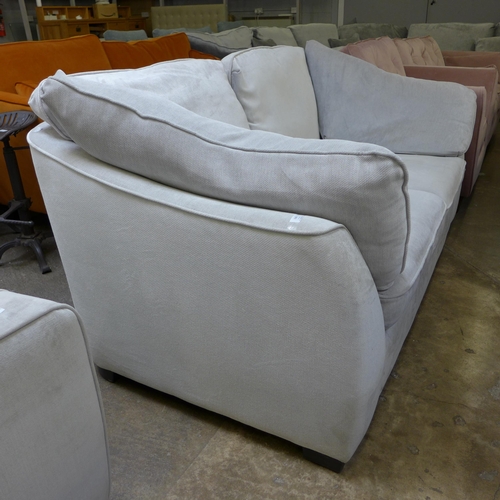 1506 - A Halley cloud white upholstered 2.5 seater sofa - damaged