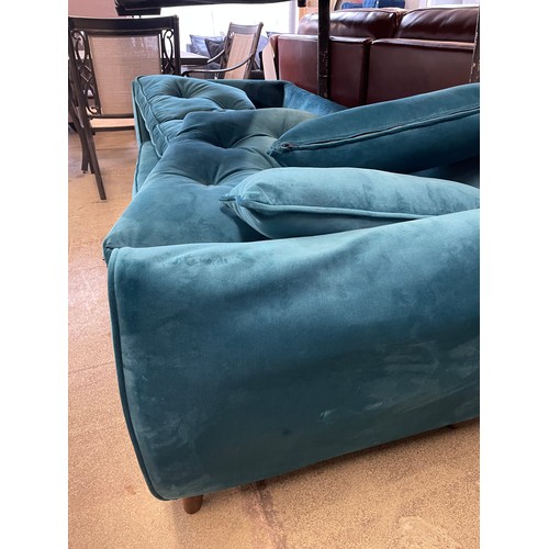 1552 - A teal velvet three seater sofa (damaged) and a small grey two seater sofa (missing cushions)