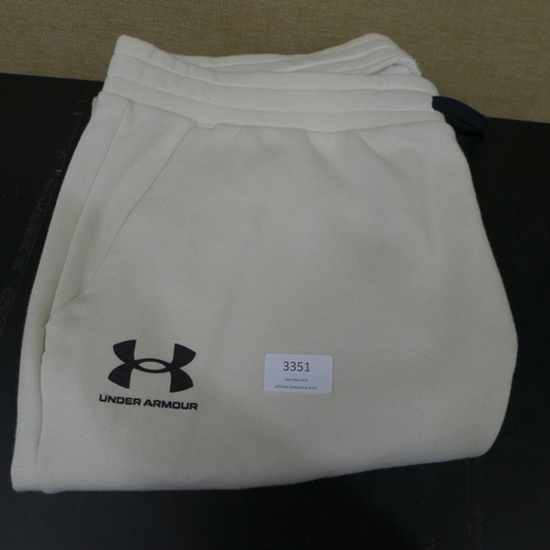 3351 - Qty of mixed sized/style Under Armour cream jogging bottoms  * This lot is subject to VAT