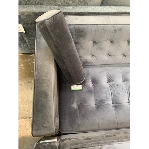 1410 - A pair of grey velvet buttoned back three seater sofas, small repair to one sofa as shown