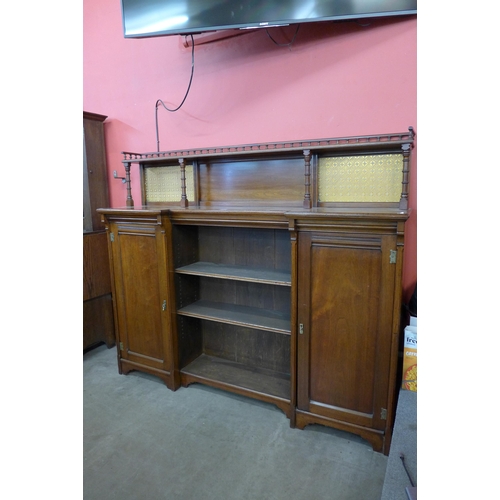 100 - A Victorian Aesthetic Movement walnut breakfront bookcase