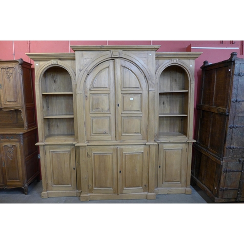 103 - A large George III style pine architectural breakfront bookcase