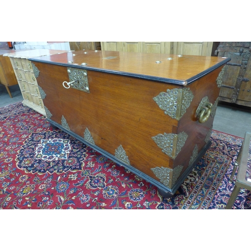 105 - A large Chinese teak, ebonised and brass mounted chest