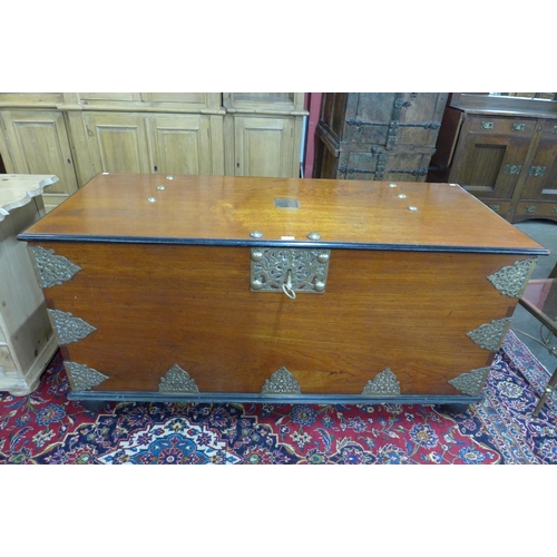 105 - A large Chinese teak, ebonised and brass mounted chest