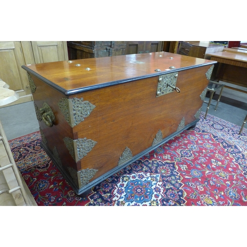 105 - A large Chinese teak, ebonised and brass mounted chest