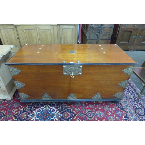 105 - A large Chinese teak, ebonised and brass mounted chest