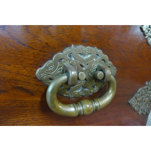 105 - A large Chinese teak, ebonised and brass mounted chest