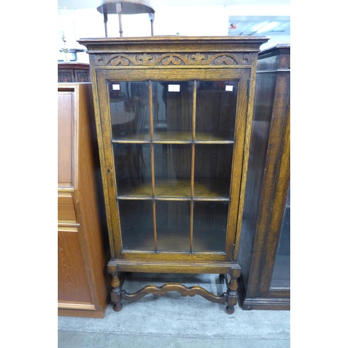 108 - An early 20th Century oak single door bookcase