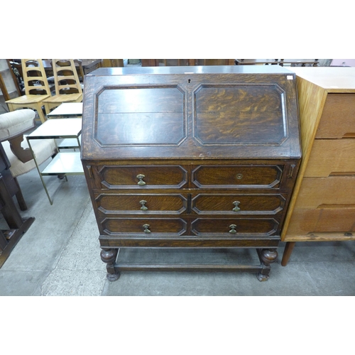 120 - An early 20th Century oak geometric moulded bureau