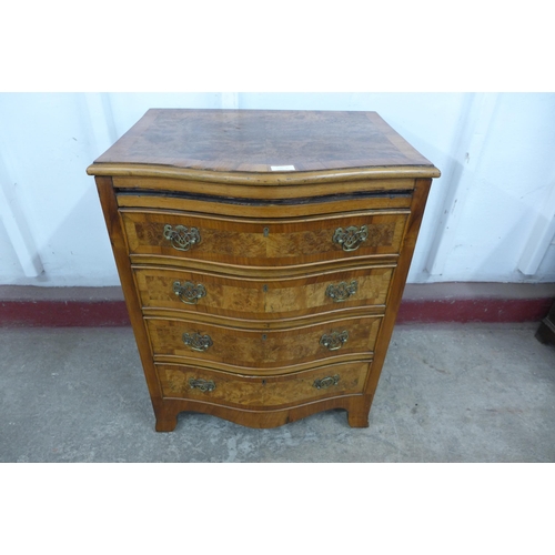 125K - A small burr walnut serpentine chest of drawers