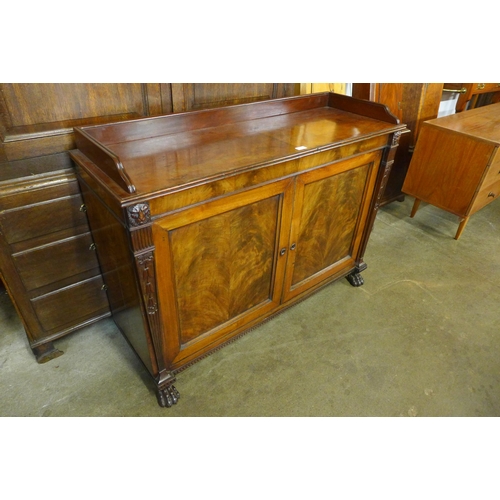 126 - A George IV mahogany enclosed two door bookcase, manner of Thomas Hope