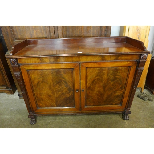 126 - A George IV mahogany enclosed two door bookcase, manner of Thomas Hope