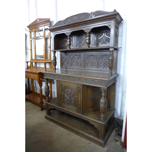 127 - An Elizabethan Revival carved oak dresser