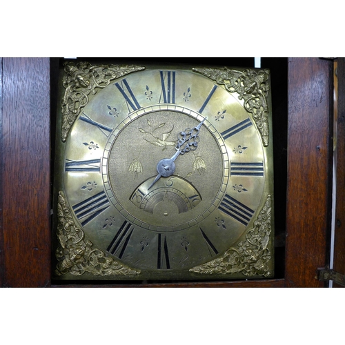 129 - A George III oak 30-hour longcase clock, the brass dial signed George Green, Leicester