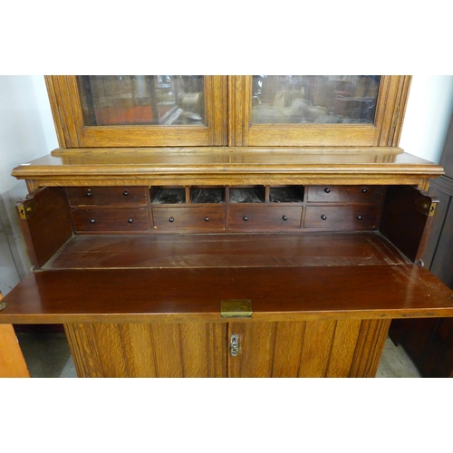 134 - A Victorian oak secretaire bookcase