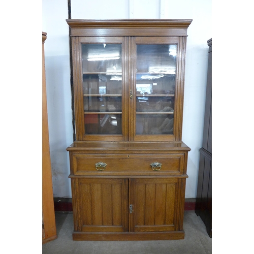 134 - A Victorian oak secretaire bookcase