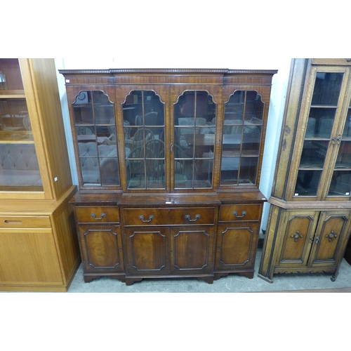 141 - A Regency style mahogany breakfront secretaire bookcase